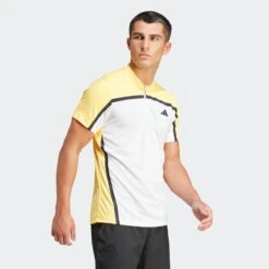 ADIDAS Freelift Pro Tennis Polo -Sporting Goods Store IS8969 6 APPAREL OnModel WalkingView grey
